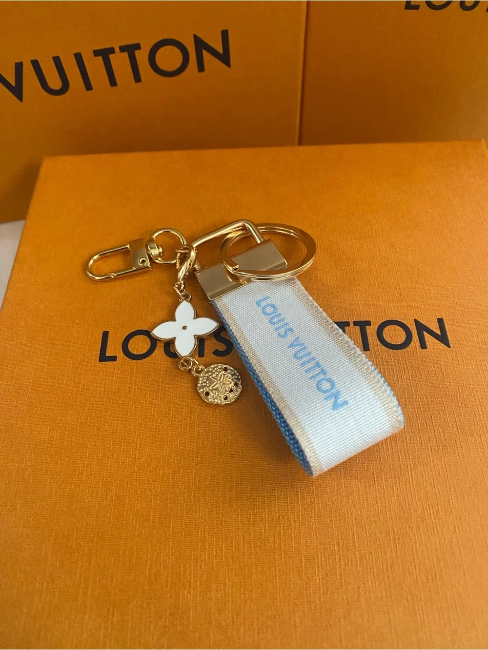 Louis Vuitton White and Light Blue Ribbon Keyring with Gold Hardware